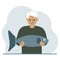 A old male fisherman holds a large fish, proud of good fishing or hunting. Hobby, fishing concept.