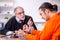 Old male judge meeting with young captive in courthouse