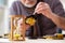 Old male watchmaker working in the workshop