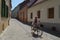 Old man by bike on cobbled street in Sibiu, Romania