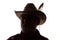 Old man in cowboy hat, front view - dark close-up silhouette