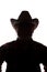 Old man in cowboy hat, front view - dark close-up silhouette