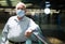 Old man in face mask standing in airport