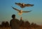 Old Man Feeding Hovering Seagulls