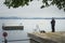 Old man fishing quietly on the shores of Lake Zugersee.