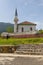 Old man in front of the mosque in the village of Lure, Albania.