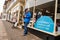 Old man on his mobile phone outside a charity shop in the seaside town of Cromer in Norfolk