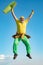 Old man jumping on blue sky background. Freedom retirement concept. Funny Senior man Jumping.