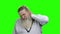 Old man with neck pain on green screen.