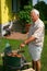 Old man outside cooking