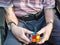 Old man playing a cube puzzle to help with brain injury and bleed.Hampshire,England,United Kingdom