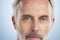 Old man, portrait and serious, face with beauty and grooming, hygiene with skincare on studio background. Closeup