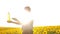 Old man sunlight farmer sunflower oil concept agriculture. old man farmer holding in hand a plastic bottle sunflower oil