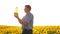 Old man sunlight farmer sunflower oil concept agriculture. old man farmer holding in hand a plastic bottle sunflower oil