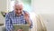 Old man using video chat on tablet