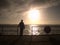 Old man watch the morning sea over pier handrail