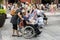 Old man in a wheelchair on qianmen street in Beijing