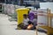 Old man and women beggar sitting at pathway for begging money from people