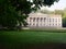 Old manor with columns in a green park. Wolsztyn, Poland