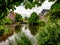 Old mansion with little bridge, amsterdam on a river