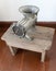 An old manual meat grinder on a wooden table