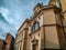 Old massive building in Europe in old style architecture design with interesting facade with ornaments as a important building of