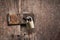 Old master key rusty lock wooden door.