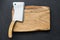 Old meat cleaver and chopping board, table top view