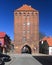 Old mediaeval gothic red brick stone Koszalinska Gate or tower in a small town of Slawno, wester Pomerania, Poland.