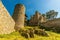 Old mediaval castle and tower with few rocks