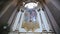 Old medieval church altar with alight candles