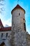 Old medieval European tower in Tallinn over a clean blue sky