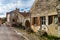 Old medieval houses on the cobbled street in ancient french village Noyers