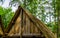 Old medieval looking wooden rooftop with a thatched roof, historical architecture background