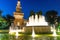 Old medieval Sforza Castle Castello Sforzesco facade, walls and tower La torre del Filarete with lights, trees, lighting fountain