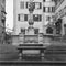 An old Medieval square in the center of Zurich old town, deserted during the lockdown shot with black and white analogue technique