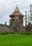 Old medieval stone castle ruins, castle tower with new roof structure, Ergeme castle ruins