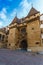 Old medieval stone gated entrance with towers