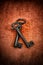 Old medieval wrought iron keys on red background