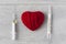 An old mercury thermometer with syringe and red heart on wood background. Medical health care