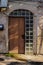 Old metal brown door with window a beautiful vintage background