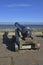 Old metal cannon facing out to sea at St Andrews, Fife, Scotland on a sunny day