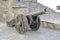 Old metal cannon on the wall of the fortress