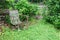 Old metal chair, green ground cover, copy space, death grief absence concept