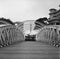 Old metal colonial bridge on the Singapore river in black and white analogue film photography - 1