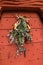 Old metal door with studs in the shape of a pyramid with a christmas decoration