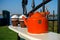 Old metal enamel kettle on fence display