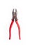 Old metal pliers with red handles