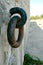 Old Metal ring shackle on concrete wall rusting