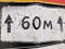 old metal road sign 60 meters straight